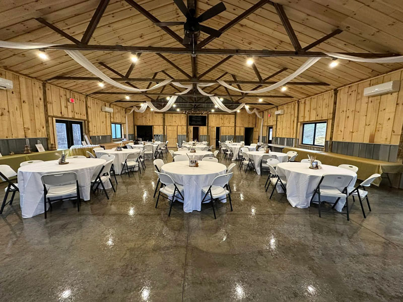 Rustic Charm Barn Wedding & Event Venue in New Lexington, Ohio, offers a picturesque and elegant setting for weddings and special events. Surrounded by scenic countryside, this charming venue combines rustic wooden beams and modern amenities, creating a warm and inviting atmosphere. Whether hosting a romantic ceremony or a lively reception, Rustic Charm Barn provides a stunning backdrop for unforgettable celebrations with its spacious indoor and outdoor spaces.
